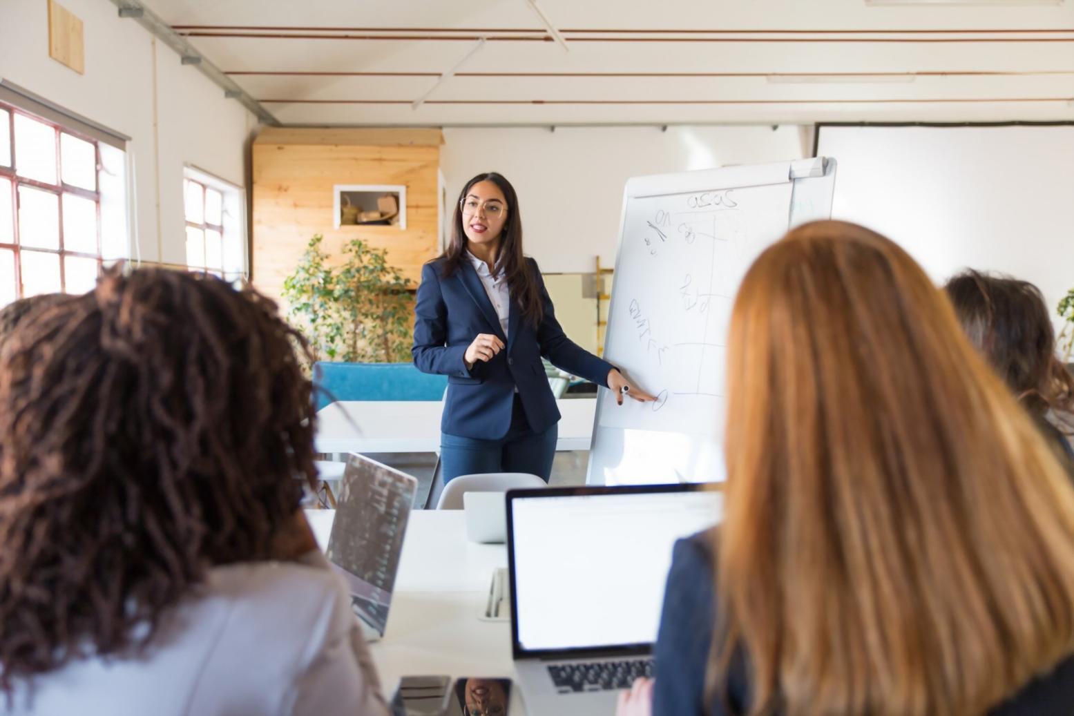 Early budget analysis work showing spreadsheets and financial documents